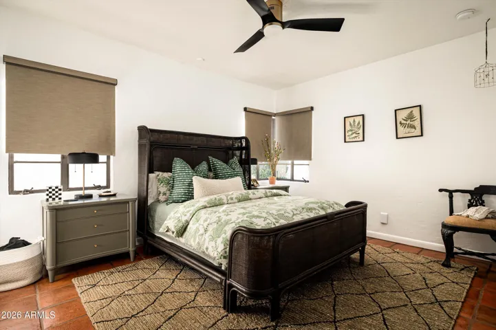 A guest bedroom shaped by softness and light, offering a quiet refuge where comfort and calm invite unhurried rest.