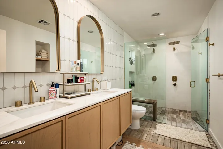 A spa inspired space where sculpted plaster and soft light invite quiet indulgence