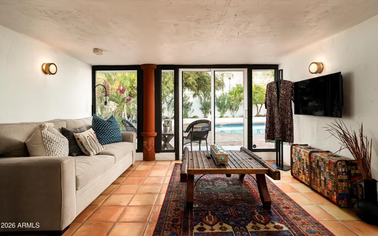 A Spanish inspired guest house where textured walls, warm light, create a quiet retreat set gently apart from the main home.