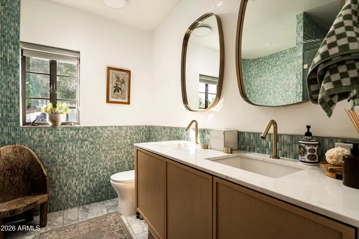An intimate bath defined by texture, pattern, and timeless artistry