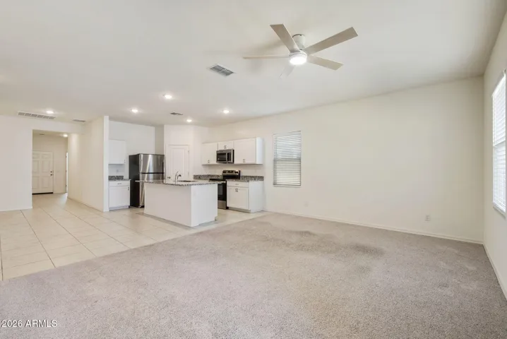 KITCHEN OVERLOOKING GREAT ROOM AND DINING ROOM