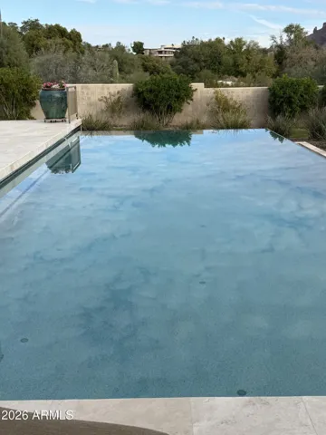 The deep, negative edge swimming pool offers soothing views as well as refreshing swimming. Deeper depth helps keep the water cooler in the summer heat. Pool has roman fountains and color changing light feature, and can be heated for winter enjoyment.