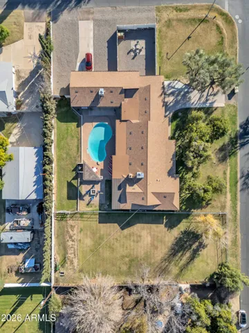 Aerial view of the space buyers are searching for — pasture, pool, BBQ area, main residence, and detached guest house all on one flexible property.