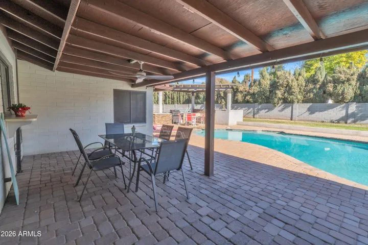 Step outside to the moments this property was made for — covered patio, sparkling pool, and space to gather, celebrate, and unwind.