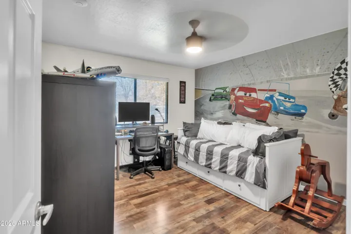 Secondary bedroom with closet organizer and an easy opportunity to personalize with your own style.