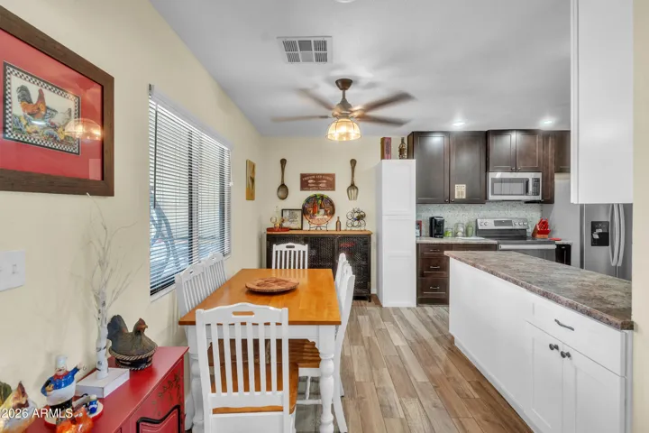 Efficient guest house dining area with convenient flow between the kitchen and living room.