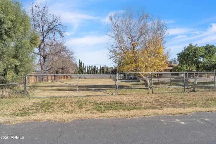 A gated pasture space full of possibility — animals, garden plans, hobbies, or simply the freedom to use the land your way.