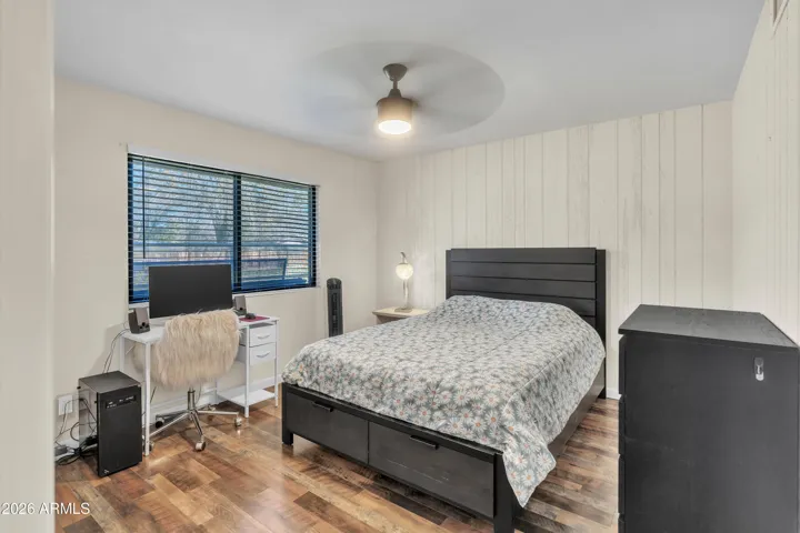A charming secondary bedroom with organized closet space and flexible potential for the next owner’s needs.