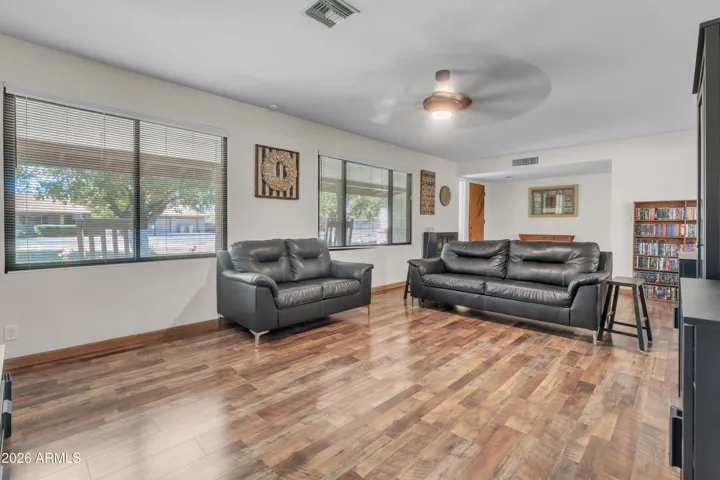 Expansive main living room with flexible layout and newer flooring.