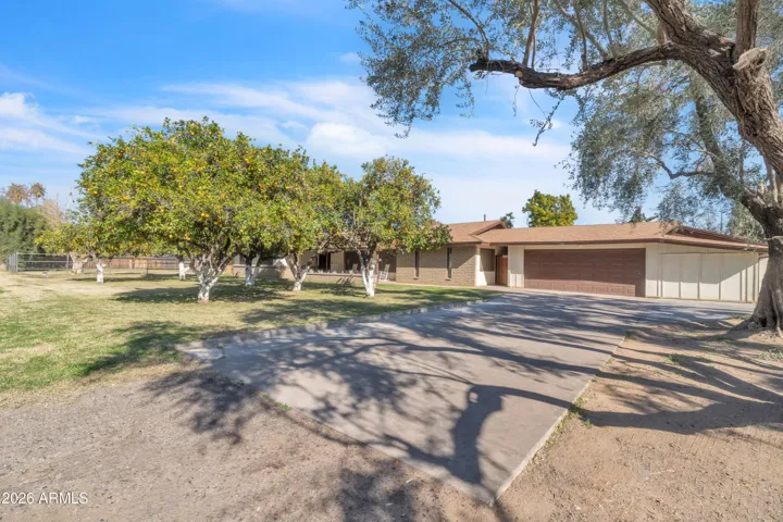 Expansive concrete pad provides flexible outdoor space for RV/boat storage, basketball court, additional parking, or workspace for projects and hobbies.