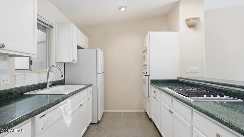 Lots of cabinets for storage, including two pantry closets.