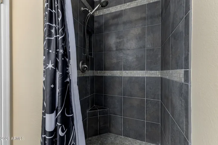 Tiled walk in shower in primary bath