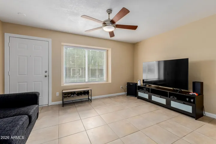 Family room overlooks green space w/ lots of natural light flooding the area.