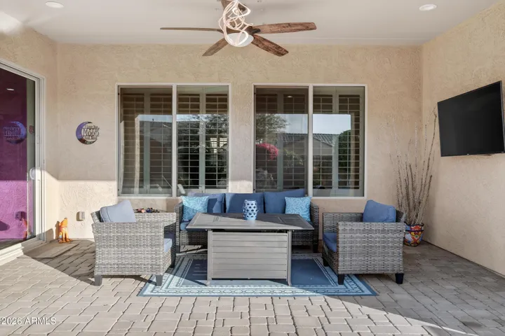Added pavers flows throughout the backyard space. Relax outdoors w/ TV