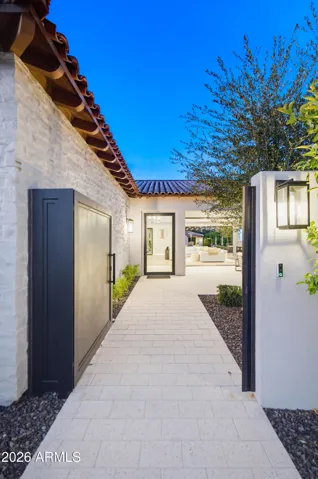 Gated entry to walled courtyard and front entrance