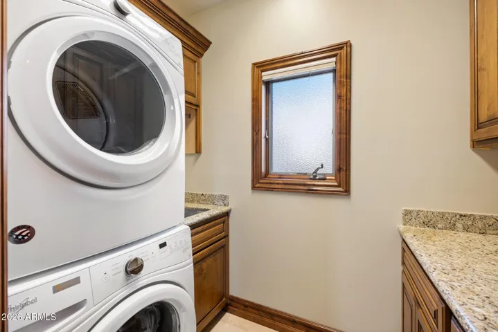 Adjacent to loft and conveniently located near the primary suite and 2nd ensuite bedroom.