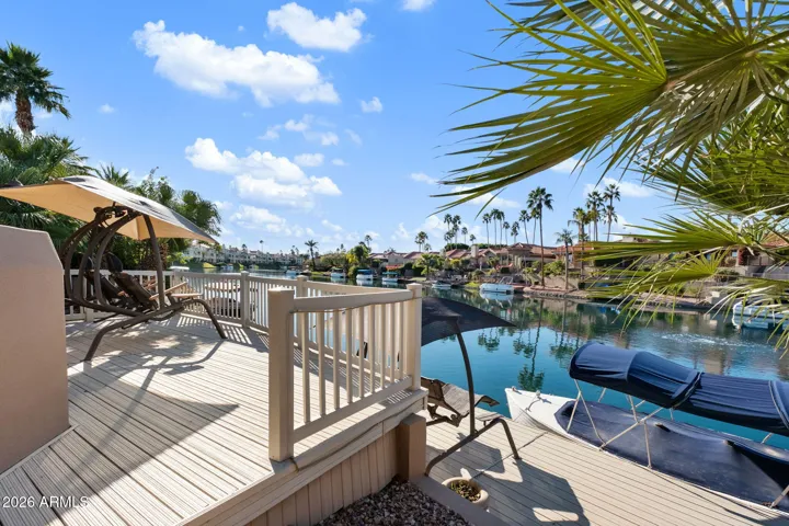 Step down towards the waterfront for your own sun deck overlooking the water, or continue walking towards your private dock and boat.