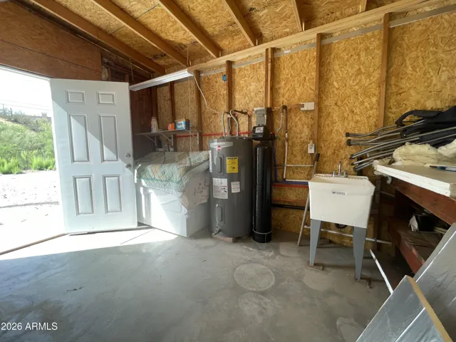 Laundry room also has an outside door and plenty of storage area