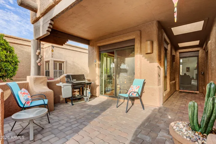 Welcome to 25515 N Forest #15! Walk through beautiful paver patio to the front entry.