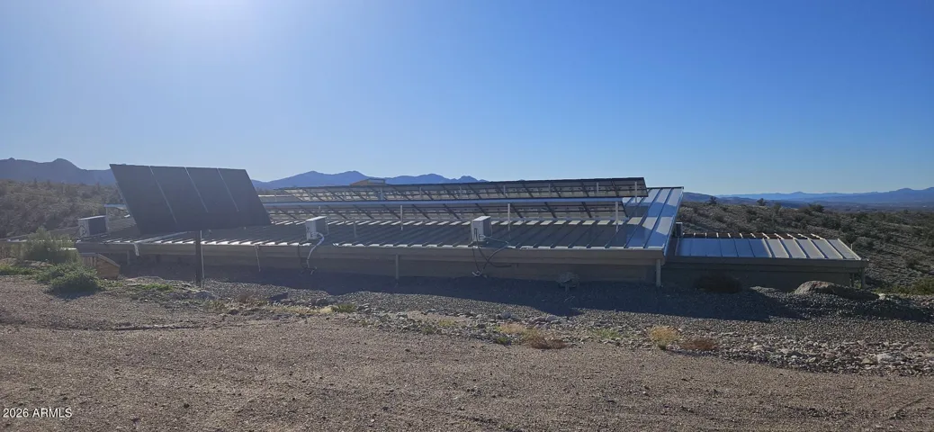 The house is built into the berm. The roof line is just above grade.