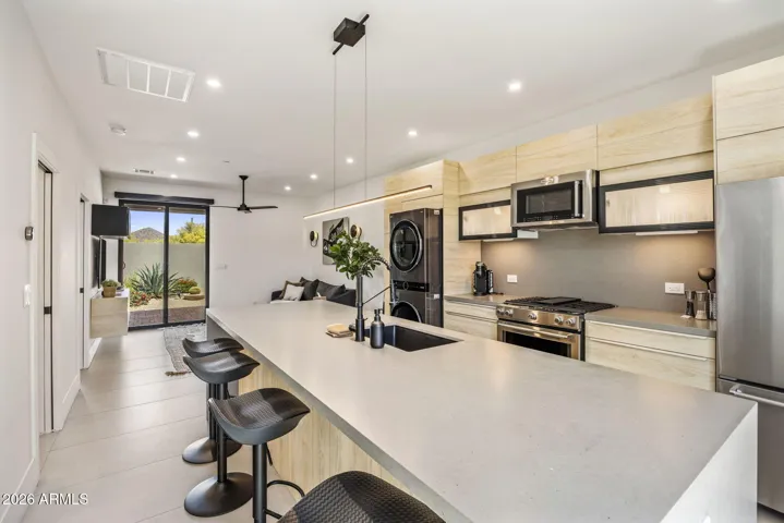 Fully equipped kitchen with waterfall island and stainless steel appliance package. Casita has private courtyard and private back patio too!