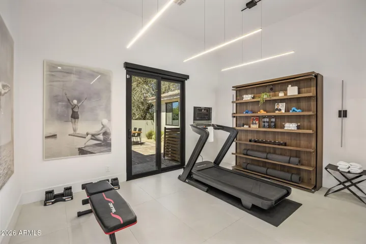 Custom shelving which converts to a Murphy bed for versatile living!