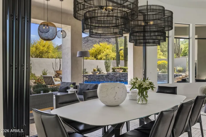 Framed by mountain views and seamless indoor - outdoor living