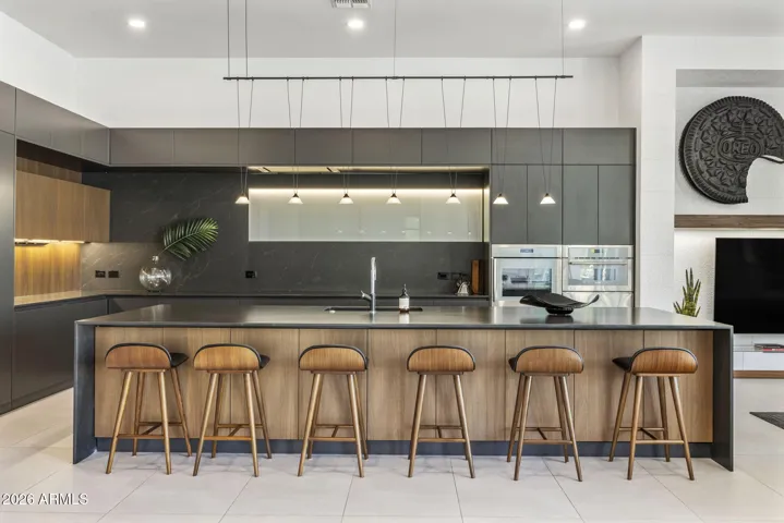 Featuring Custom Scavolini Cabinetry, Caesarstone countertops and waterfall island