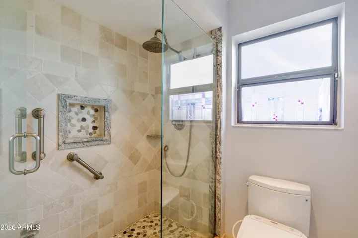 The master bathroom and tiled shower.