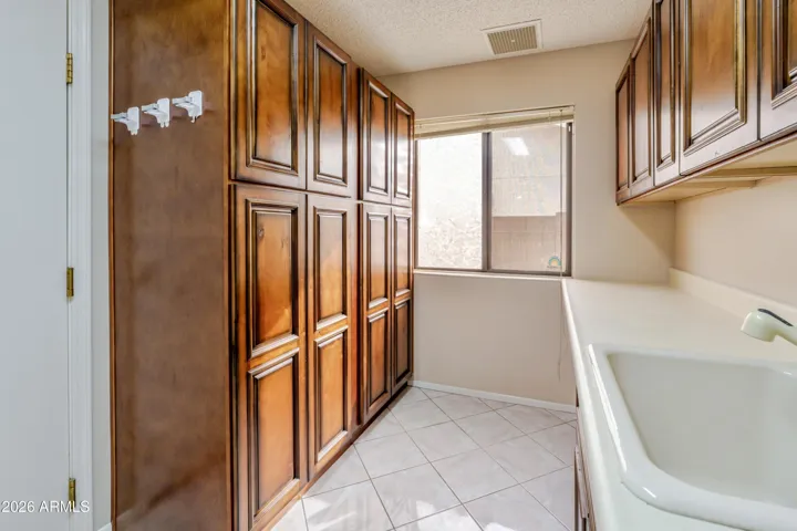 The updated laundry room has tons of storage.