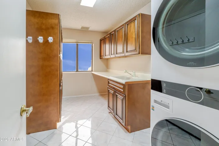 The updated laundry room has tons of storage.