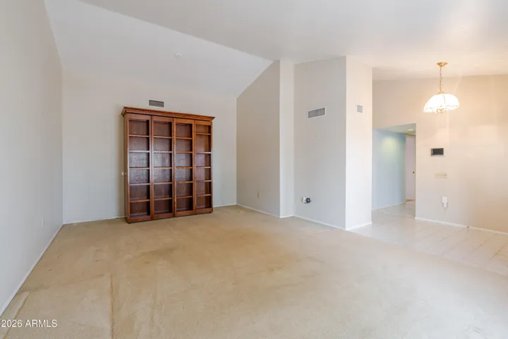The living room with a Murphy Bed / Bookcase.