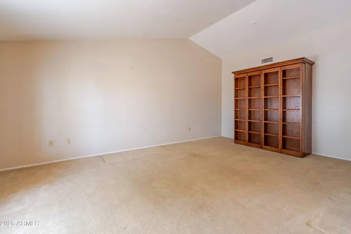 The living room with a Murphy Bed / Bookcase.