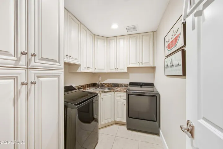 laundry room with sink and storage and new Washer/Dryer