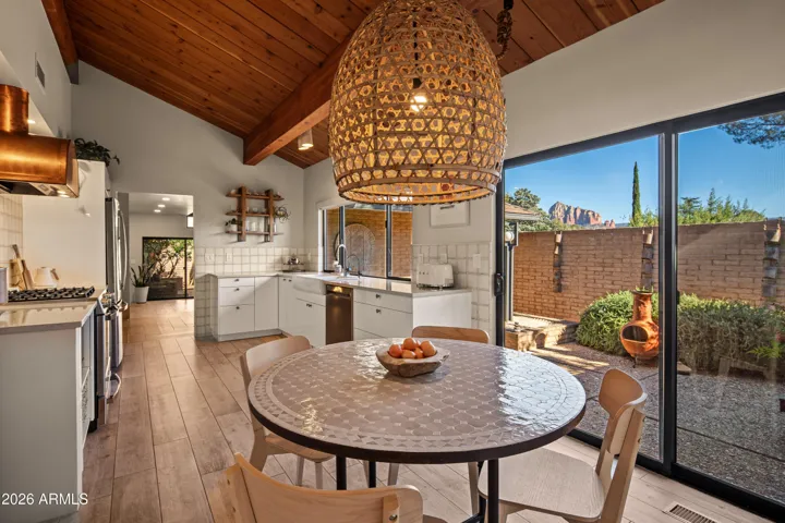 A casual dining space for everyday with access to the front courtyard.