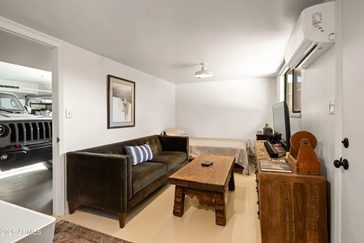 Tucked behind the garage, this versatile space offers endless opportunities.