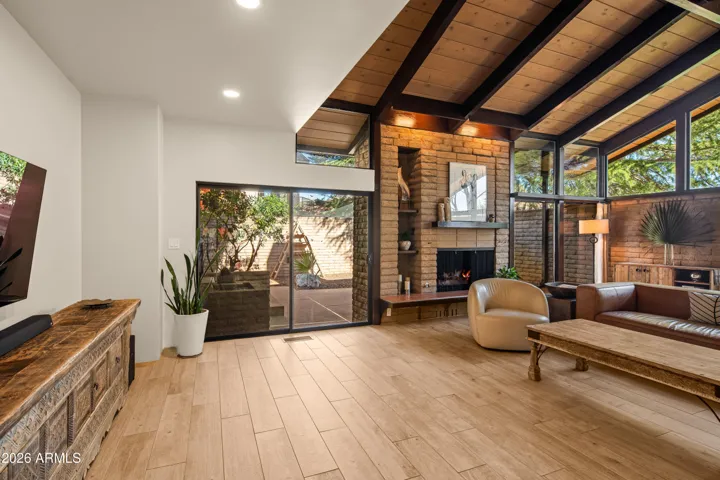 This amazing room is light and bright from floor to ceiling windows.