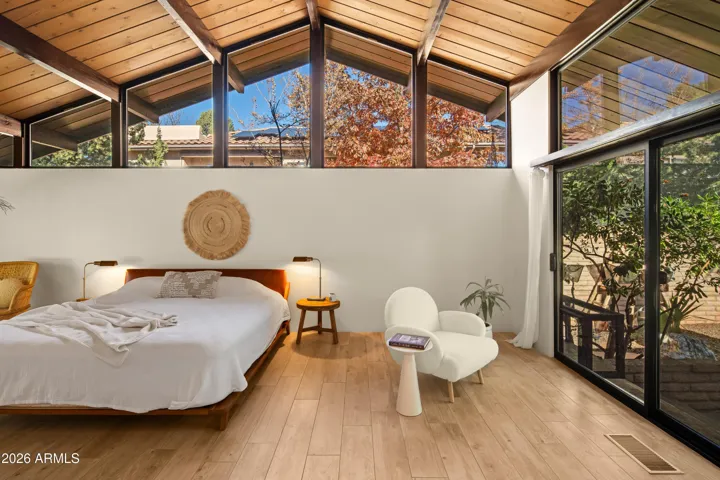 A light filled room with sliders to a quaint courtyard and the backyard.