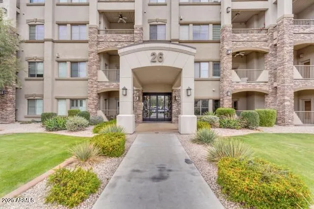 The grand entrance of Building 26 at Toscana of Desert Ridge welcomes you with timeless architecture, lush landscaping, and secure access. This upscale Phoenix community offers resort-style living with exceptional amenities just steps from your front door.