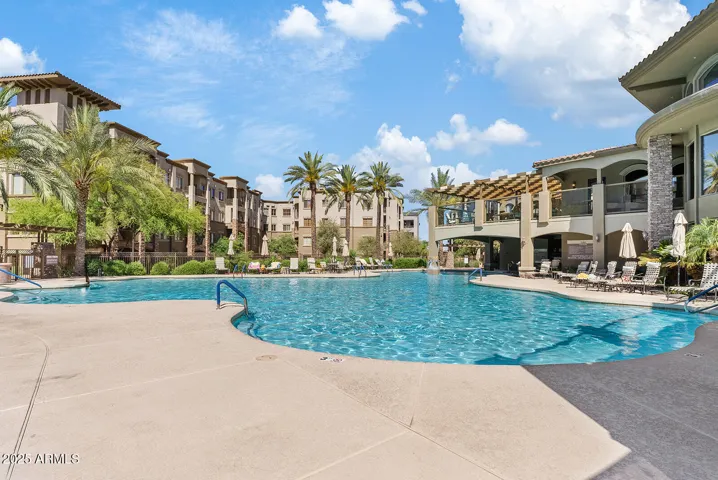 Enjoy year-round relaxation at the community’s heated pool surrounded by palm trees and lounge seating. This resort-inspired amenity enhances everyday living with a vacation-style atmosphere.