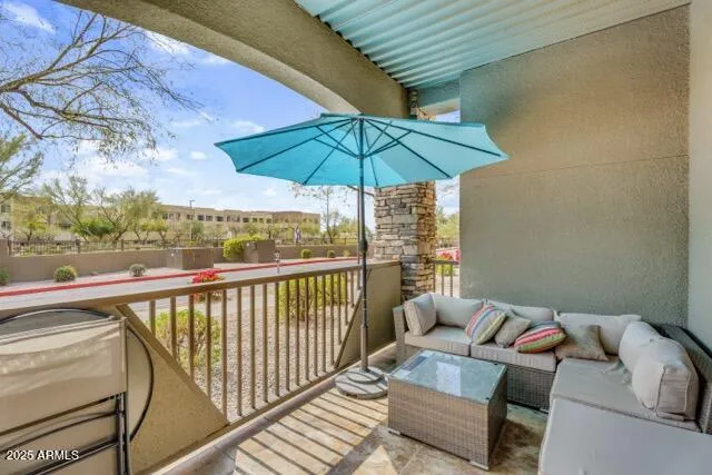 Step outside to your personal outdoor oasis, complete with comfortable seating and a retractable shade. This covered patio is perfect for enjoying the Arizona sunshine or unwinding in the cool evening breeze.