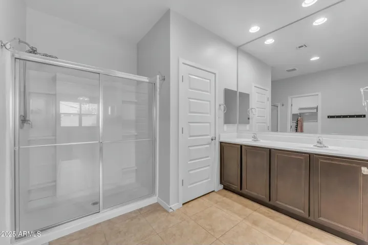 Primary Bathroom, dual vanities, walk in shower, walk in closet