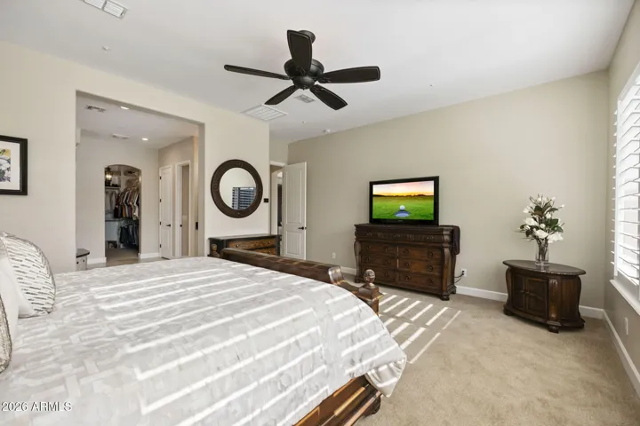 Primary Bedroom with entrance to bathroom.