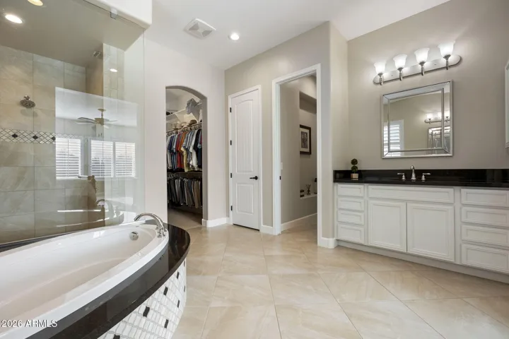 Primary walk-in shower & closet.