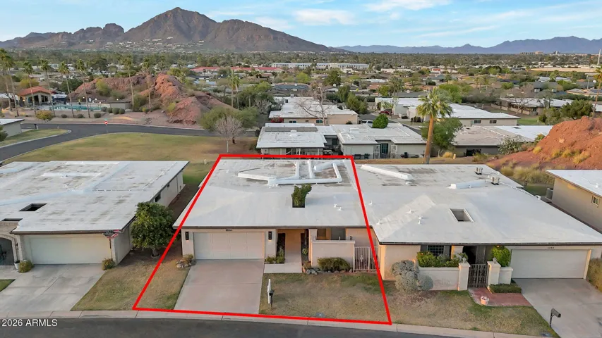 Gaze north across the neighboring community clubhouse & swimming, to Camelback Mountain.