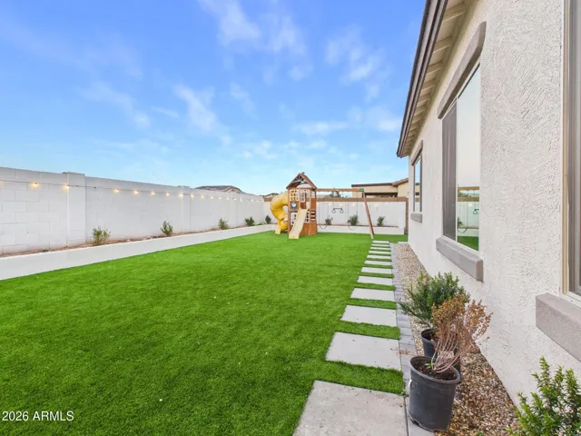 A sprawling backyard offers endless potential for entertaining, play, or future customization. With exceptional space and thoughtful upgrades already in place, this outdoor setting invites you to create your ideal Arizona oasis.