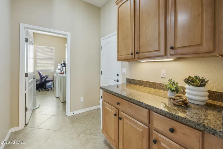 Butler pantry next to garage access and large laundry room