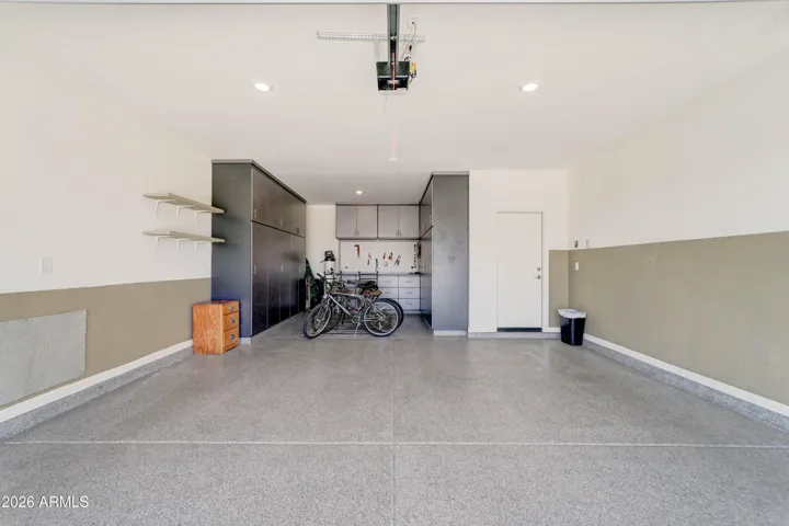 2.5 Car Garage - Full Size - Spacious & Open - Custom Built Cabinets w/ Work Space - Beautiful Epoxy Flooring