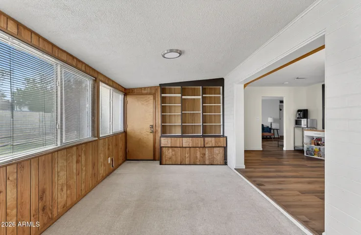 Light-filled bonus room with expansive windows and built-in storage, perfect for hobbies, a media room, or guest overflow. The added living space increases flexibility and long-term value in this Phoenix home.