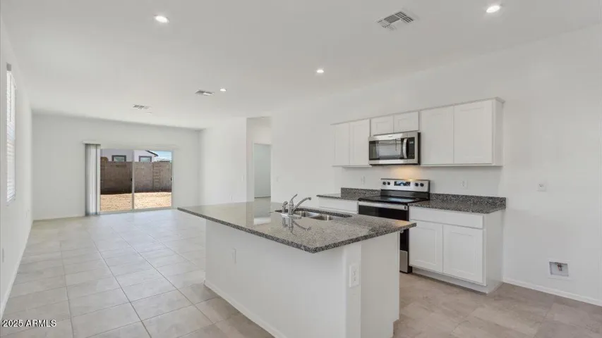 Photos are of a spec and may vary in color, interior selections and design